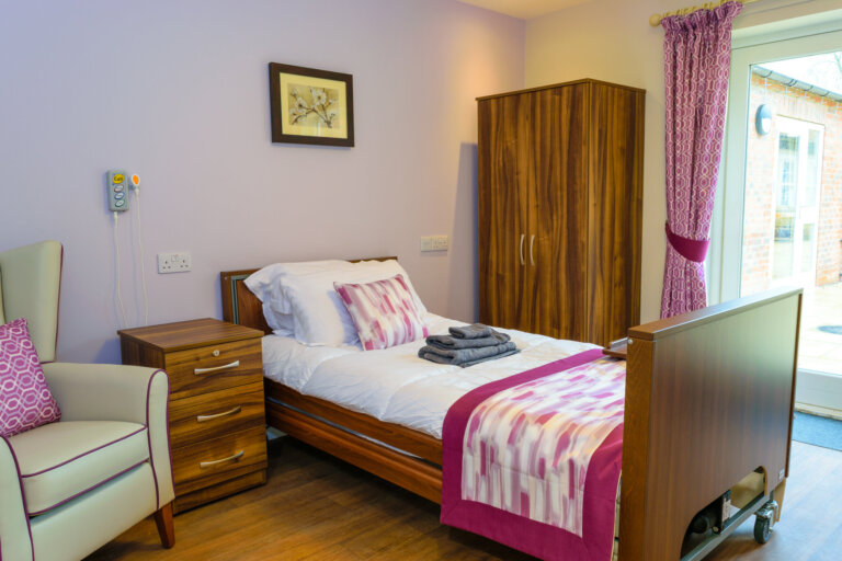 A beautifully decorated bedroom at Oaktree Hall and Lodge Care Home