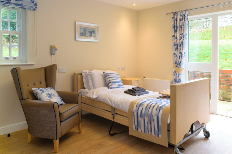 A bright and cheerful bedroom at Oaktree Hall and Lodge Care Home