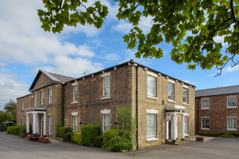 Explore the inviting entrance to Figham House Care Home, a gateway to compassionate care and comfort.
