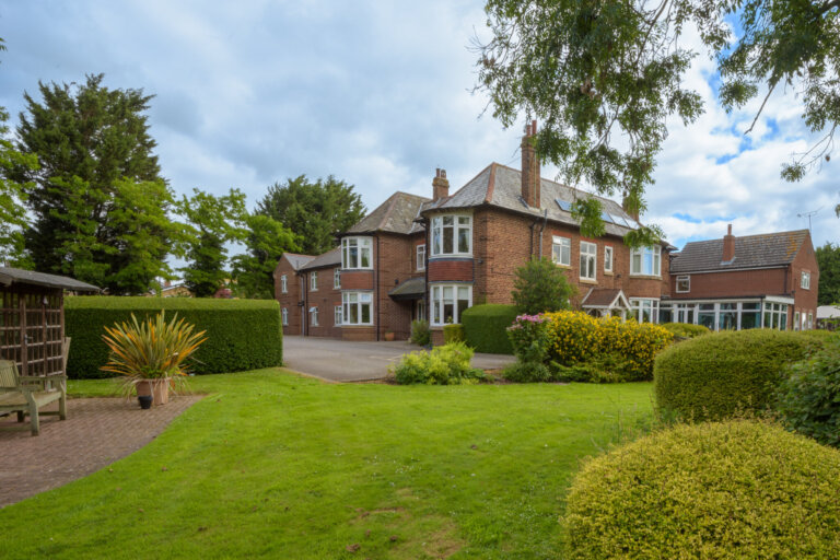 A view of the garden and sun room where the residents sit to look at the gardens at Cranswick Lodge Care Home in Hutton Cranswick