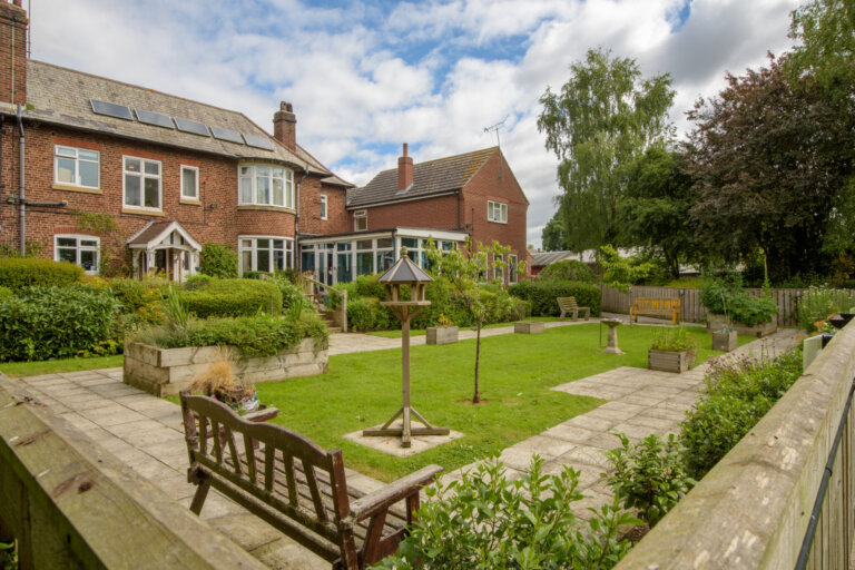 Another view of the lovely garden at Cranswick Lodge, where bird feeders offer interest to the Driffield residents