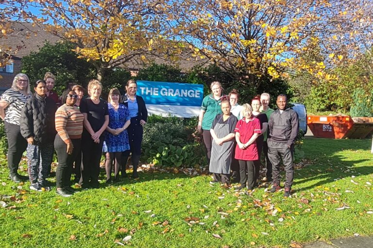 The Grange team in Darlington pose outside the popular care home