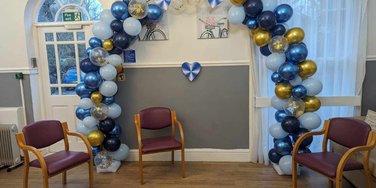 412405842_356934507076551_1975466612681505455_n An image of the balloon arch where the happy couple's nuptial took place at The Elms Care Home in Louth, Lincolnshire.