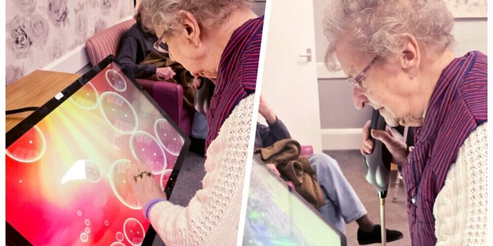 A resident at Foresters Lodge tries out the new interactive table
