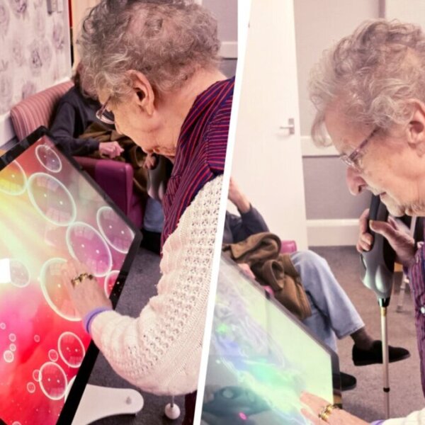 A resident at Foresters Lodge tries out the new interactive table